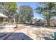 Backyard boasts a stone patio, outdoor seating, a stone firepit and lush landscaping at 955 Golf View Ct, Dacula, GA 30019