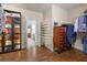 Spacious walk-in closet with custom shelving, dark wood floors, and ample storage space for clothing and accessories at 955 Golf View Ct, Dacula, GA 30019