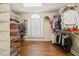 Well-organized walk-in closet with custom shelving, drawers, and ample storage space at 955 Golf View Ct, Dacula, GA 30019