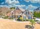 Stately home with a lush front lawn, mature landscaping, and a welcoming entrance at 955 Golf View Ct, Dacula, GA 30019