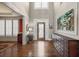 Bright foyer featuring hardwood floors, high ceilings, and a front door with glass panels at 955 Golf View Ct, Dacula, GA 30019