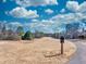 Picturesque view of a local golf course featuring manicured greens, vibrant sky and walking path at 955 Golf View Ct, Dacula, GA 30019