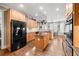 Spacious kitchen with granite countertops, wooden cabinets, and stainless steel appliances at 955 Golf View Ct, Dacula, GA 30019