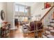 Elegant living room featuring hardwood floors, a fireplace, and a staircase at 955 Golf View Ct, Dacula, GA 30019
