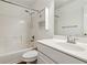Bathroom with a white vanity, white tiled floors, a shower and a toilet at 2075 Pine Tree Dr # D4, Buford, GA 30518