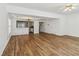 Spacious open concept with fireplace, wood floors and view of the kitchen at 2075 Pine Tree Dr # D4, Buford, GA 30518