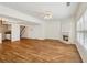 Open-concept living area with fireplace, wood floors and abundant light at 2075 Pine Tree Dr # D4, Buford, GA 30518