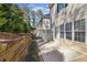 Back patio showing privacy wall, patio, and trees at 2075 Pine Tree Dr # D4, Buford, GA 30518