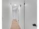 Bright hallway with multiple doors and neutral walls at 5079 N Dogwood Hills Dr, Buford, GA 30518