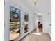 Bright entryway featuring double glass doors with a wreath and light wood flooring at 5079 Ne Dogwood Hills Dr, Buford, GA 30518