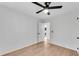 Minimalist bedroom featuring hardwood floors and ample natural light coming through the window at 5079 Ne Dogwood Hills Dr, Sugar Hill, GA 30518