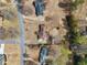 A beautiful aerial view shows a well-maintained house with a spacious yard and mature trees in a quiet neighborhood at 755 Rounsaville Rd, Roswell, GA 30076