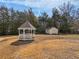 Tranquil backyard featuring a charming gazebo and a small storage shed at 755 Rounsaville Rd, Roswell, GA 30076