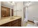 Bathroom featuring a marble-topped vanity and a classic tub with shower combination at 755 Rounsaville Rd, Roswell, GA 30076