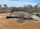 Aerial view of a single-story house with a long driveway and large yard at 755 Rounsaville Rd, Roswell, GA 30076