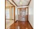 Foyer featuring hardwood floors, paneled walls, and a unique front door at 755 Rounsaville Rd, Roswell, GA 30076