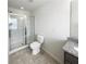 Clean bathroom featuring a glass enclosed shower and granite vanity at 807 Ambient Sw Way, Atlanta, GA 30331
