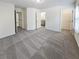 Spacious bedroom featuring plush carpet, a walk-in closet, and ensuite bathroom at 807 Ambient Sw Way, Atlanta, GA 30331