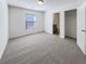 Bright bedroom featuring neutral carpeting and an ensuite bathroom at 807 Ambient Sw Way, Atlanta, GA 30331