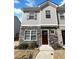 Charming townhome featuring stone accents and neutral siding with well-maintained landscaping at 807 Ambient Sw Way, Atlanta, GA 30331