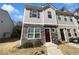 Charming townhouse with stone accents, well-manicured lawn, and inviting front entrance at 807 Ambient Sw Way, Atlanta, GA 30331