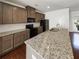 Modern kitchen featuring granite countertops, stainless steel appliances, and ample cabinet space at 807 Ambient Sw Way, Atlanta, GA 30331