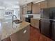 Well-equipped kitchen with granite countertops, stainless steel appliances, and open layout at 807 Ambient Sw Way, Atlanta, GA 30331