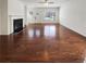 Spacious living room boasts gleaming hardwood floors and a cozy fireplace at 807 Ambient Sw Way, Atlanta, GA 30331