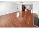 Open-concept living area boasting hardwood floors, fireplace, and a view into the kitchen at 807 Ambient Sw Way, Atlanta, GA 30331