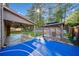 This backyard showcases a basketball court, gazebo, and covered patio, creating an ideal space for outdoor entertainment at 1118 Reddy Farm Rd, Grayson, GA 30017