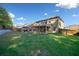 A sprawling backyard presents a gazebo, tall fence, green lawn, brick elevation, and a covered patio at 1118 Reddy Farm Rd, Grayson, GA 30017