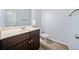 Half bath with modern dark wood cabinet and hardwood flooring at 1118 Reddy Farm Rd, Grayson, GA 30017