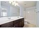 This bright bathroom features double sinks, a large mirror, and a tub-shower combo, perfect for modern convenience at 1118 Reddy Farm Rd, Grayson, GA 30017