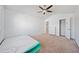 This bedroom features a ceiling fan, a closet, and natural light, creating a versatile space for relaxation and storage at 1118 Reddy Farm Rd, Grayson, GA 30017