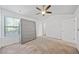 This bedroom features a ceiling fan and a window for natural light, making for a bright and airy space at 1118 Reddy Farm Rd, Grayson, GA 30017