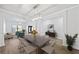 Bright dining room featuring hardwood floors, stylish lighting, and elegant furnishings with view to living room at 1118 Reddy Farm Rd, Grayson, GA 30017