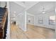Open dining area with light wood floors, wainscoting, and a modern light fixture at 1118 Reddy Farm Rd, Grayson, GA 30017