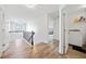 Hallway featuring wood floors and a laundry room with a washing machine at 1118 Reddy Farm Rd, Grayson, GA 30017