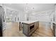 Spacious kitchen with a large island, modern appliances, and an open view to the living area at 1118 Reddy Farm Rd, Grayson, GA 30017