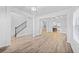 Open concept living area with hardwood floors, staircase and ample natural light, perfect for entertaining at 1118 Reddy Farm Rd, Grayson, GA 30017