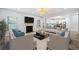 Comfortable living room with fireplace, stylish seating, open layout, and view into kitchen with stainless appliances at 1118 Reddy Farm Rd, Grayson, GA 30017