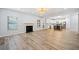 Open living room featuring a fireplace and seamless access to the modern kitchen at 1118 Reddy Farm Rd, Grayson, GA 30017