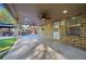 An inviting covered patio with ceiling fans, recessed lighting, and a textured concrete floor provides a relaxing outdoor space at 1118 Reddy Farm Rd, Grayson, GA 30017