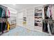 Walk-in closet with custom shelving and hanging racks for organized storage at 1118 Reddy Farm Rd, Grayson, GA 30017