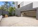 Modern home exterior with a spacious driveway and an open garage showcasing organizational systems at 1260 Brook Forest Ne Dr, Atlanta, GA 30324