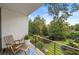 Balcony featuring a seating area and views of a landscaped backyard at 1260 Brook Forest Ne Dr, Atlanta, GA 30324