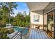 Balcony view showcasing outdoor pool, seating area, and lush landscaping at 1260 Brook Forest Ne Dr, Atlanta, GA 30324