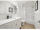 Well-lit bathroom with a modern vanity, ample storage, and a combined shower and tub at 1260 Brook Forest Ne Dr, Atlanta, GA 30324