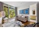 Cozy bedroom with a daybed, hardwood floors, and a large window with a backyard view at 1260 Brook Forest Ne Dr, Atlanta, GA 30324