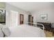 Well-lit bedroom with an adjacent bathroom and hardwood floors at 1260 Brook Forest Ne Dr, Atlanta, GA 30324